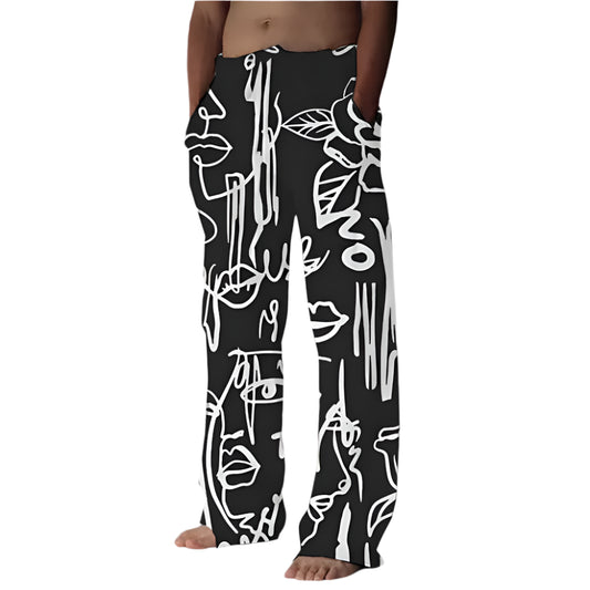 Men’s black straight-leg lounge pants with bold black graffiti-style face and flower print, elastic waistband, and artistic summer streetwear design.