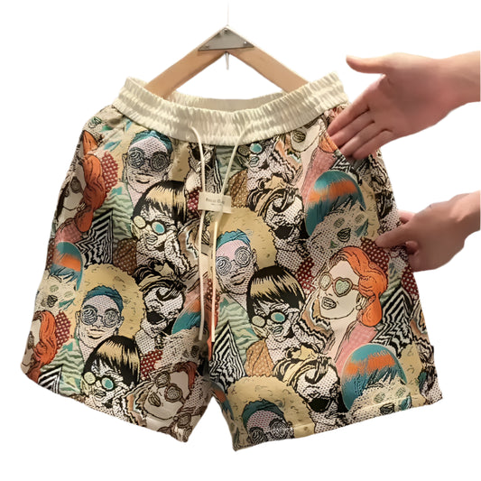 Colorful men’s vintage graffiti print shorts with elastic waistband, featuring bold retro illustrations of cartoon-style faces, displayed on hanger.